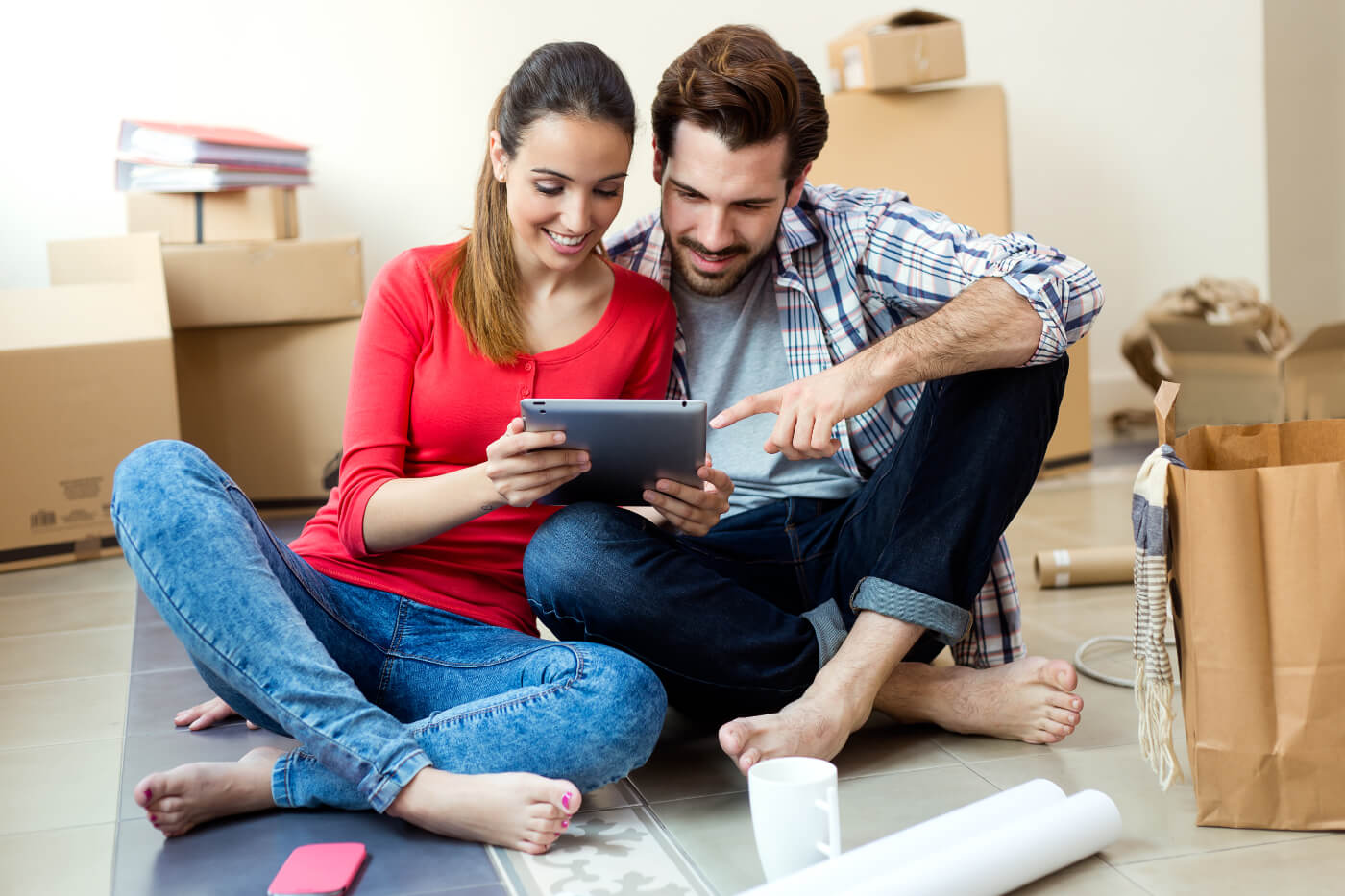 mortgage market is kinder to borrowers - young-couple-with-digital-tablet-their-new-home