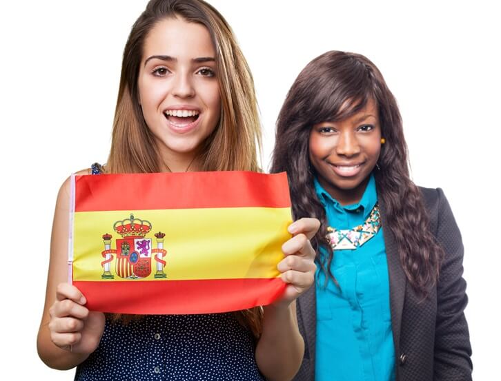 Girls holding Spanish flag
